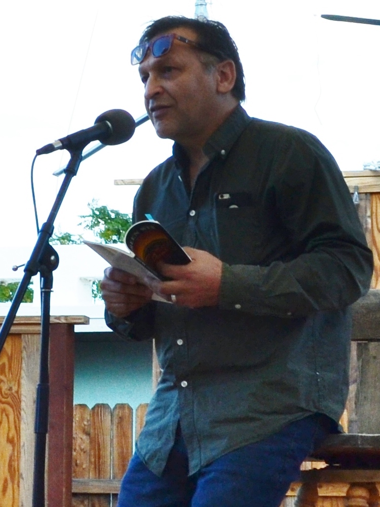 Juan Delgado reading at Cholla Needles