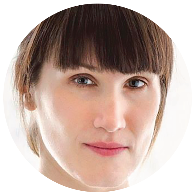 Close-up photo portrait of a woman with blunt dark bangs