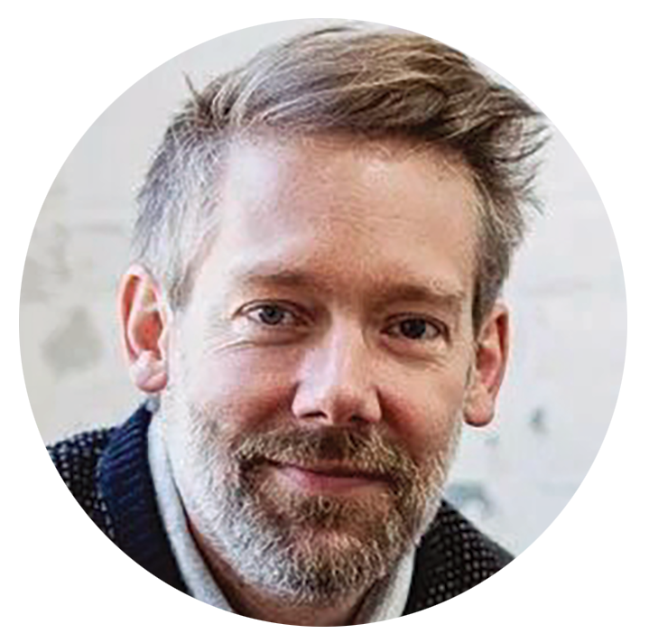 Photo portrait of a man with salt-and-pepper hair and beard