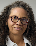 A thumbnail portrait of Tanya McKinnon, a Black woman with medium-dark skin, brown curly hair, and glasses.