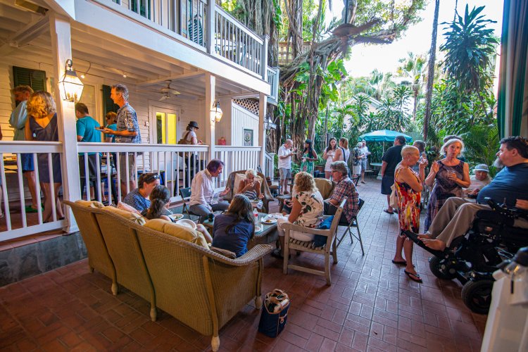 Outdoor patio potluck at the Studios of Key West