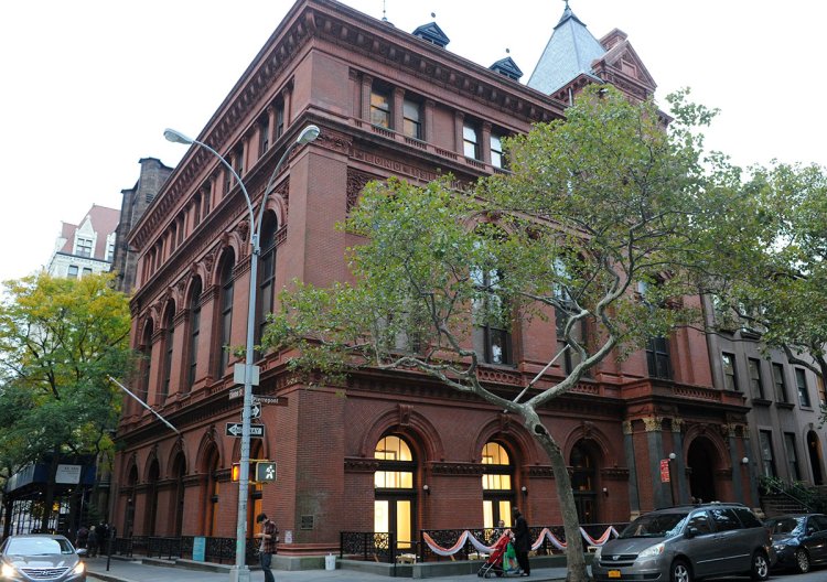 Center for Brooklyn History Large three-story building on the corner with big windows and a tree in front.