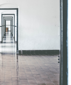 A series of empty doorframes extend into the distance. 