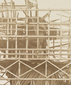 Archival image of the Statue of Liberty surrounded by scaffolding