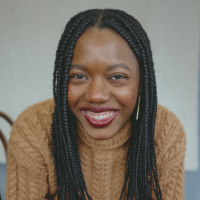 Headshot of Rasheeda Saka Headshot of Rasheeda Saka, wearing a tan sweater and smiling